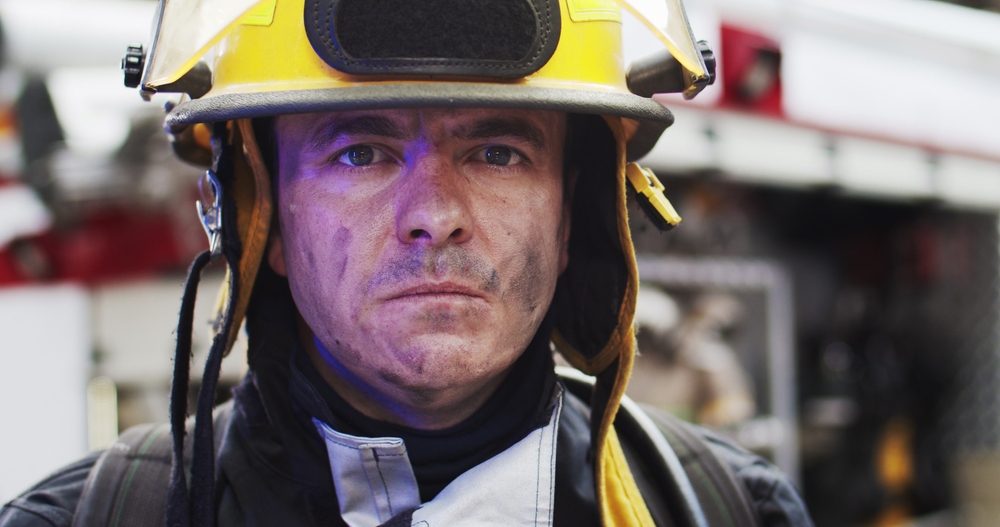 closeup of serious firefighter: cancer awareness month